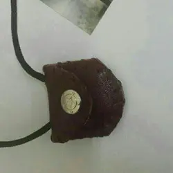 گردن آویز شامل دستنویس حرز امام جواد روی پوست گوسفند