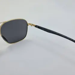 خرید عینک آفتابی پلاریزه برند ریبن با فریم طلایی و دسته مشکی مدل D21533 | فروشگاه آرکوشاپ