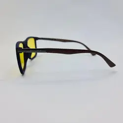 خرید عینک آفتابی پلاریزه برند پلیس با عدسی زاپاس زرد رنگ و دسته چوبی مدل P5051 | فروشگاه آرکوشاپ