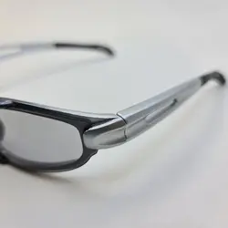 خرید عینک آفتابی ورزشی آنتی رفلکس خاکستری و دسته نقره ای رنگ مدل 115 | فروشگاه آرکوشاپ