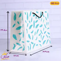 خرید ساک دستی طرح پر کاغذ گلاسه | فروشگاه اینترنتی هاکان مد