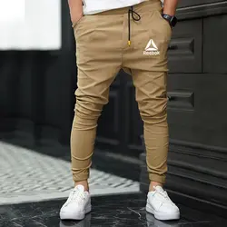 شلوار مردانه مدل اسلش بنگال کش رنگ شتری ریبوک reebok