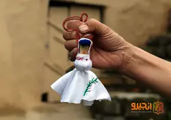 عروسک محلی با طرح شاخه سرخدار