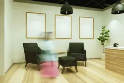 موکاپ دفتر  و تابلو های به دیوار زده شده در فضای سالن شرکت