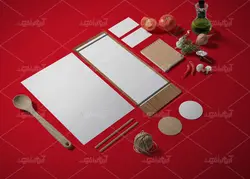 موکاپ دفترو کاغذ منو و لیست مواد اولیه به همراه سبزیجات و کاسه بشقاب