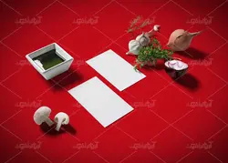 موکاپ دفترو کاغذ منو و لیست مواد اولیه به همراه سبزیجات و کاسه بشقاب