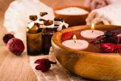 دانلود عکس با کیفیت لوازم ماساژ شمع و گل و آبگرم و روغن