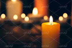 دانلود عکس با کیفیت شمع تکی نارنجی با زمینه مشکی