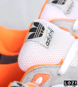 کفش کتانی مردانه طوسی سفید نارنجی آدیداس adidas ZX 750 مدل 3323