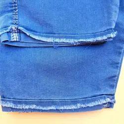 شلوارک لی دخترانه طرح ستاره گلدوزی شده با کمر کشی دارای چهار جیب پشت و پهلو