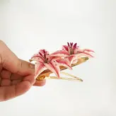 گیره مو زنانه طرح گل الستریا