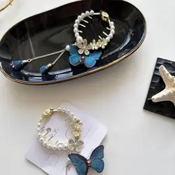 کلیپس گوجه ای مروارید و آویز پروانه گلدوزی زایا