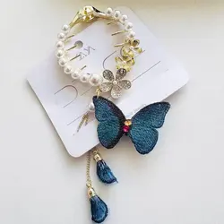 کلیپس گوجه ای مروارید و آویز پروانه گلدوزی زایا