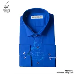 پیراهن مردانه اداری رنگ آبی کاربنی یقه برگردان آستین بلند ساده تک جیب پارچه تترون کد 20288