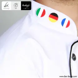 پیراهن آشپزی | پارچه ترگال | سرآشپز مدل بین الملل 3 دکمه یقه ایستاده رنگ سفید با گلدوزی پرچم مغزی دوزی کد 32632-IR