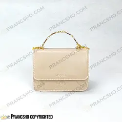 کیف پاسپورتی شنل (CHANEL) دسته فلزی طرح کوکو کرم پنککی