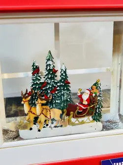 فانوس موزیکال بابانوئل و‌سورتمه گوزن ها، قرمز