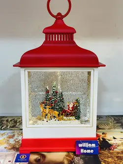 فانوس موزیکال بابانوئل و‌سورتمه گوزن ها، قرمز