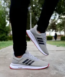 جدیدترین کفش کتونی اسپرت مدل ادیداس زیره کپسولی اسپرت مردانه و پسرانه مشکی نارنجی با ارسال رایگان 3607