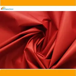 پارچه شمعی قرمز پشت نقره ای عرض 150