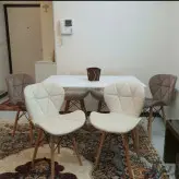 میز و صندلی غذاخوری نشیمن چوبی دوخت پارچه صنعتی مدل زین اسبی ست شش نفره