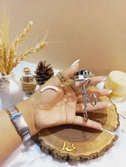 فرمژه دسته فنری تیتانیوم طلق دار مدل Pinzette Tweezers - فروشگاه عمده لوازم آرایشی ورانی