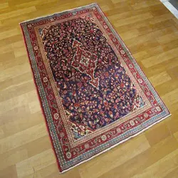 فرش دستباف جوزان ملاير طرح لچک و ترنج سایز ذرع و نيم رنگ زمینه سرمه اي رنگ حاشیه لاكي کد 38940