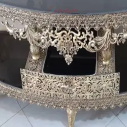 میز تلویزیون جلو خم طول 140 جنس آلیاژ آلومنیوم آبکاری برنز