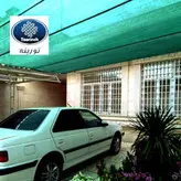 تور سبز سایبان لبه دوزی شده 80% شید عرض ۱۰ متر ضدآفتاب (آنتی یووی ) تورینه بافت