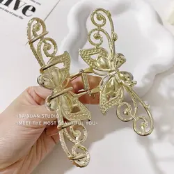 کلیپس پروانه کریستال صورتی کد 542 - فروشگاه اینترنتی دلورس