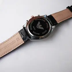 ساعت مچی عقربه‌ای مردانه مدل بندچرمی قاب فلزی تاریخ شمار سه موتور کرنوگراف کد 2